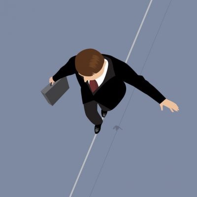 42852385 - business man on a wire. risk management concept